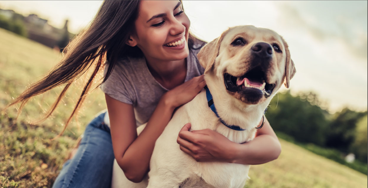 Girl hugging dog